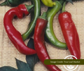 Red and green chili peppers on a woven surface with image credited to 'True Leaf Market.'